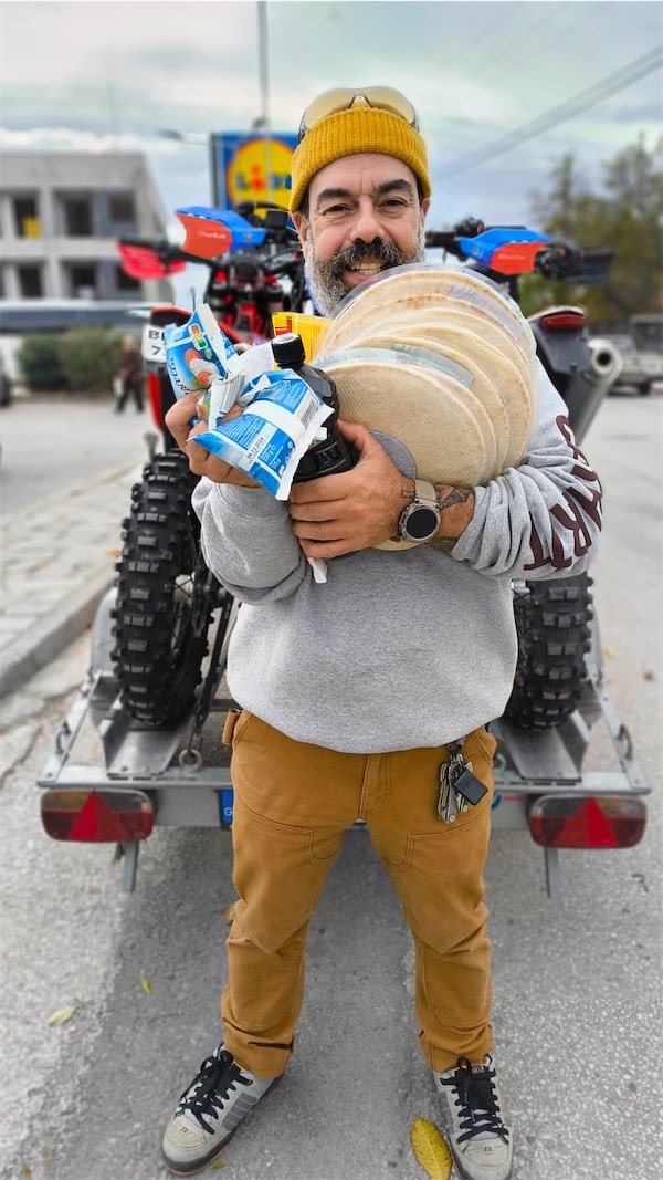 Thanasis North Star Manager is carrying supplies for a night in the cabins