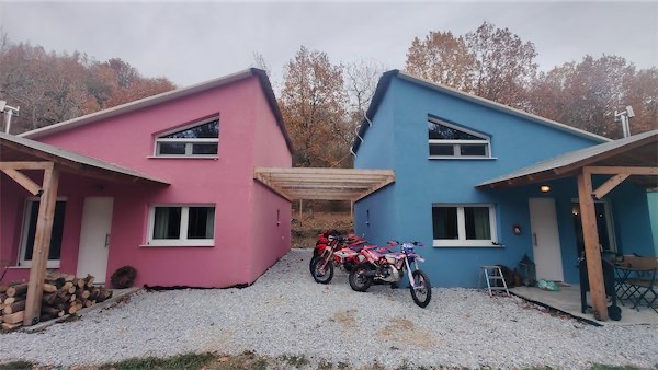 The cabins from front with some Beta motorcycles between them